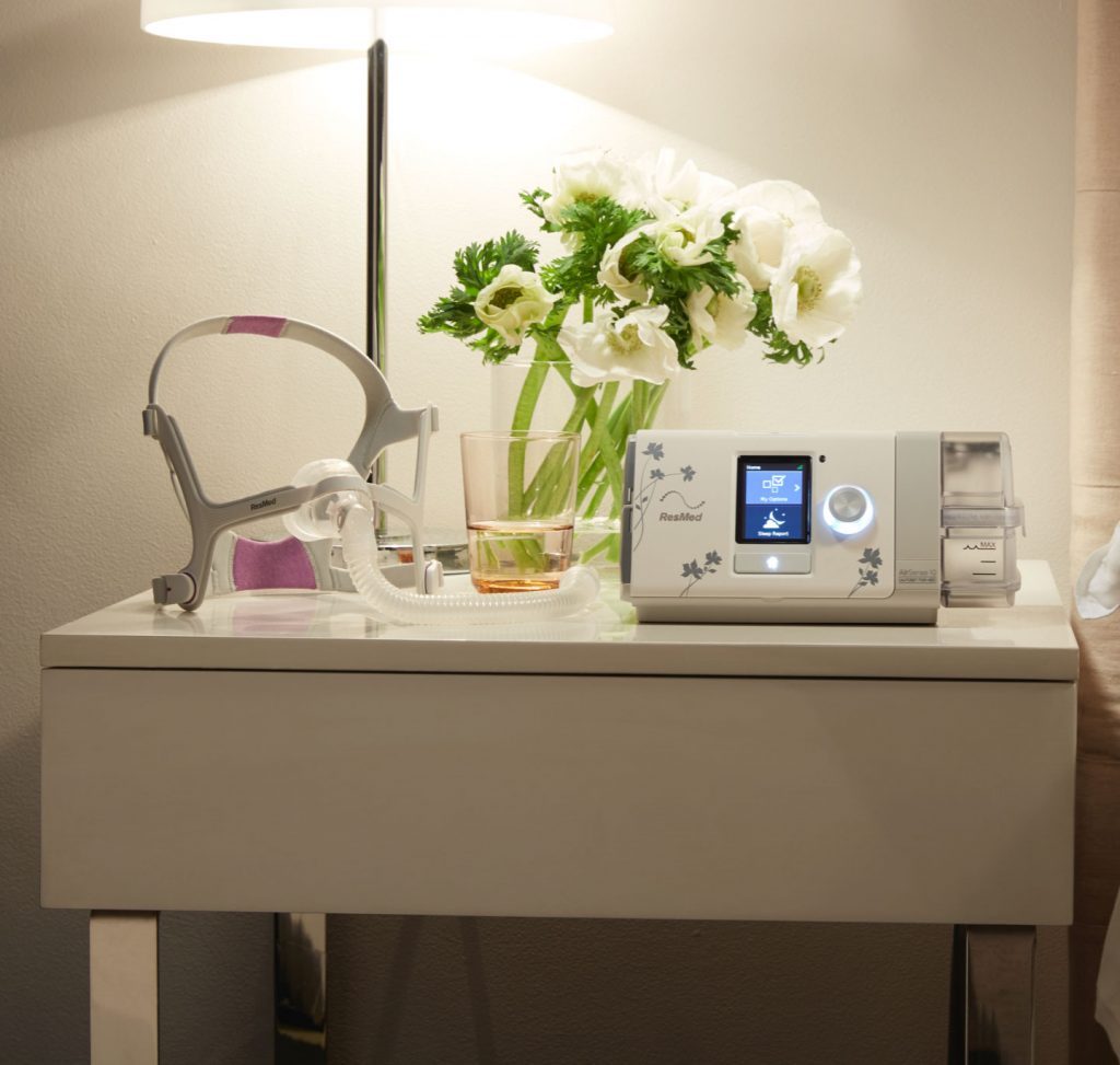 Photo of the AirSense 10 CPAP machine for her on a table.