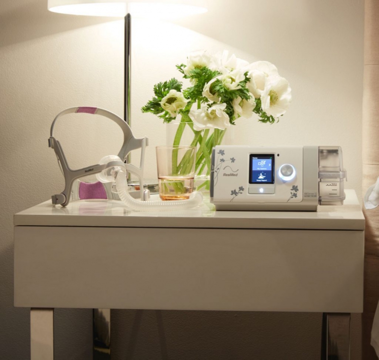 Photo of the AirSense 10 CPAP machine for her on a table.