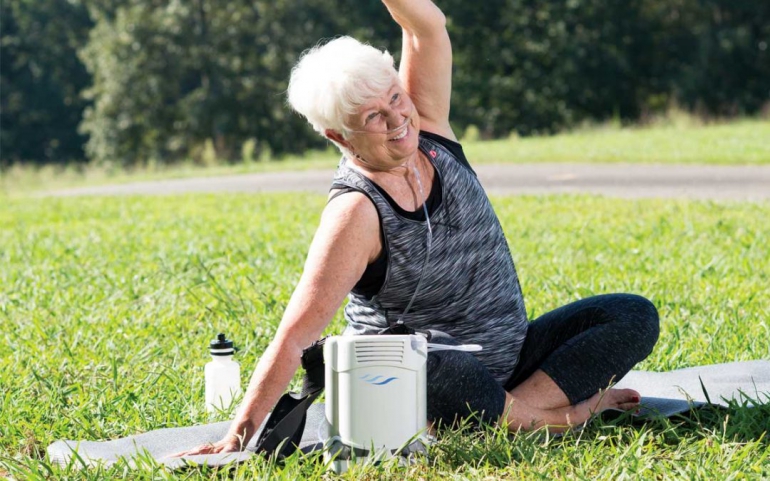 Photo of a woman exercising outside and also using her FreeStyle Comfort.