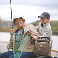 Photo of the SimplyGo Portable Oxygen Concentrator with a person outside fishing. thumbnail