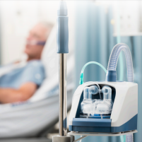 AIRVO 2 Patient thumbnail Photo of the AIRVO 2 on a table with a patient in the background. thumbnail