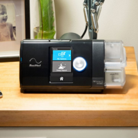 Photo of the AirSense 10 CPAP machine on a table. thumbnail
