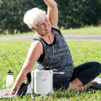 Photo of a woman exercising outside and also using her FreeStyle Comfort. thumbnail