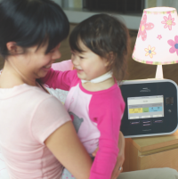 Photo of a mom and her child who is using the CoughAssist E70. thumbnail